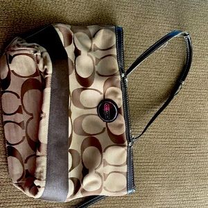 Brown and tan coach purse.